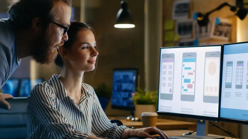 Female UX Architect Has Discussion with Male Design Engineer Female UX Architect Has Discussion with Male Design Engineer